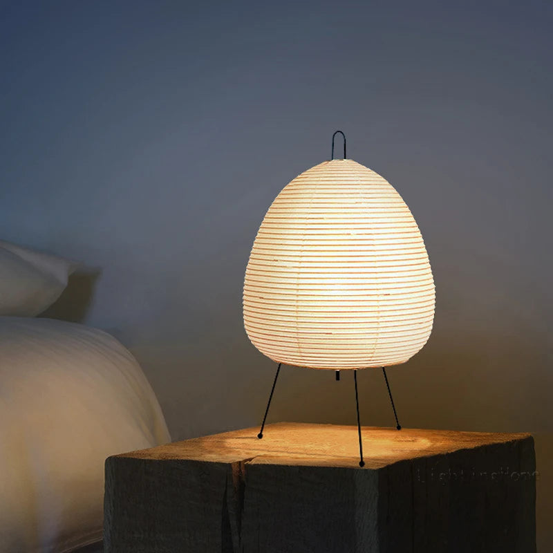 Akari lamp placed on a side table or desk, adding a touch of minimalist Japanese design and creating a peaceful retreat in the room.