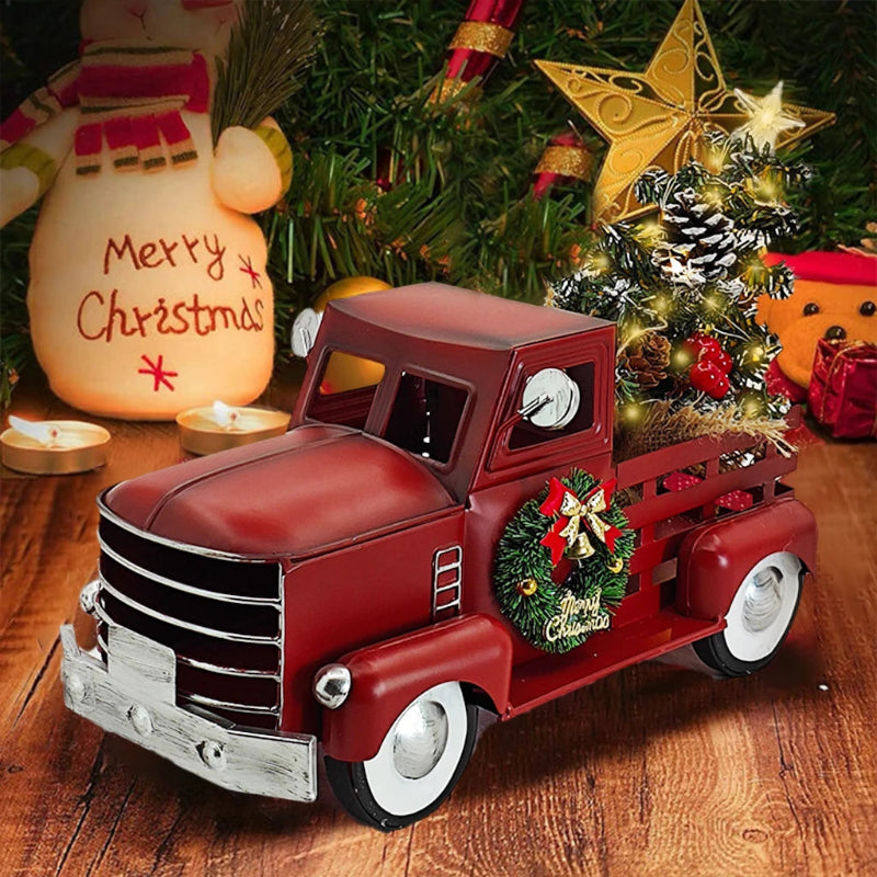Red toy truck with Christmas tree and wreath.