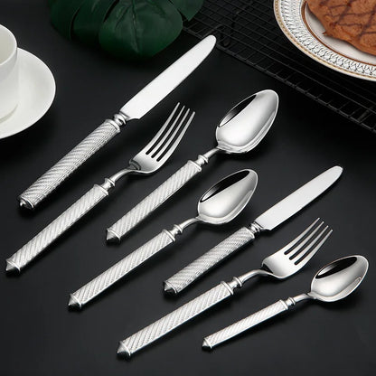 Silverware set on black surface
