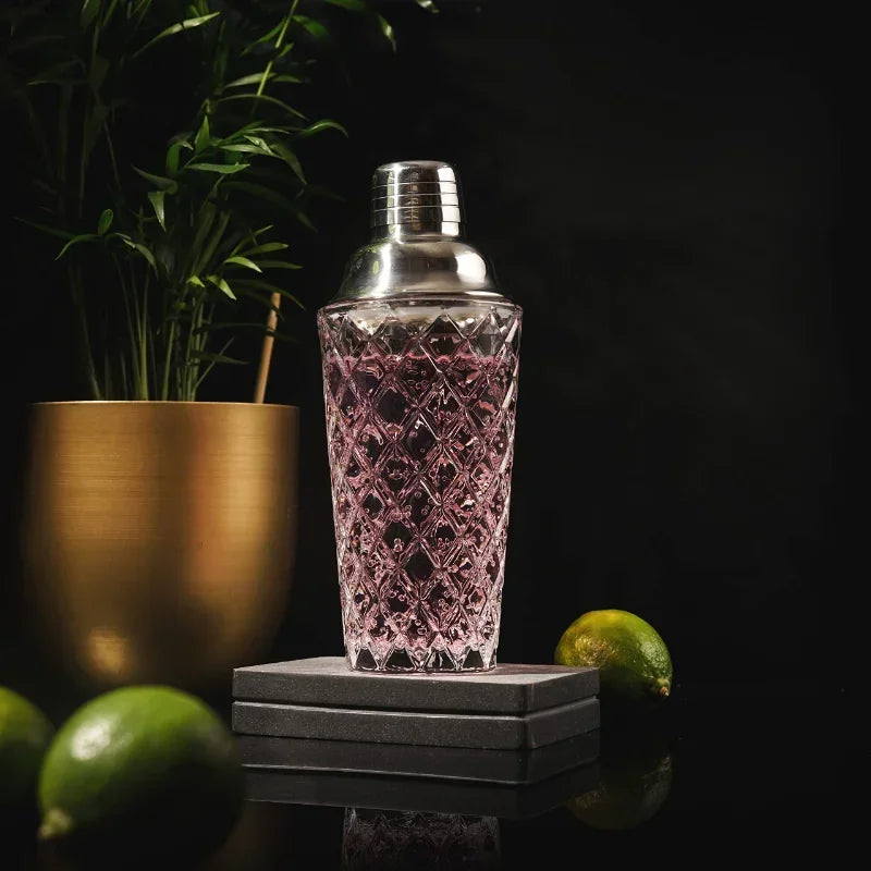 Durable glass cocktail shaker with a leak-proof metal lid and built-in strainer.