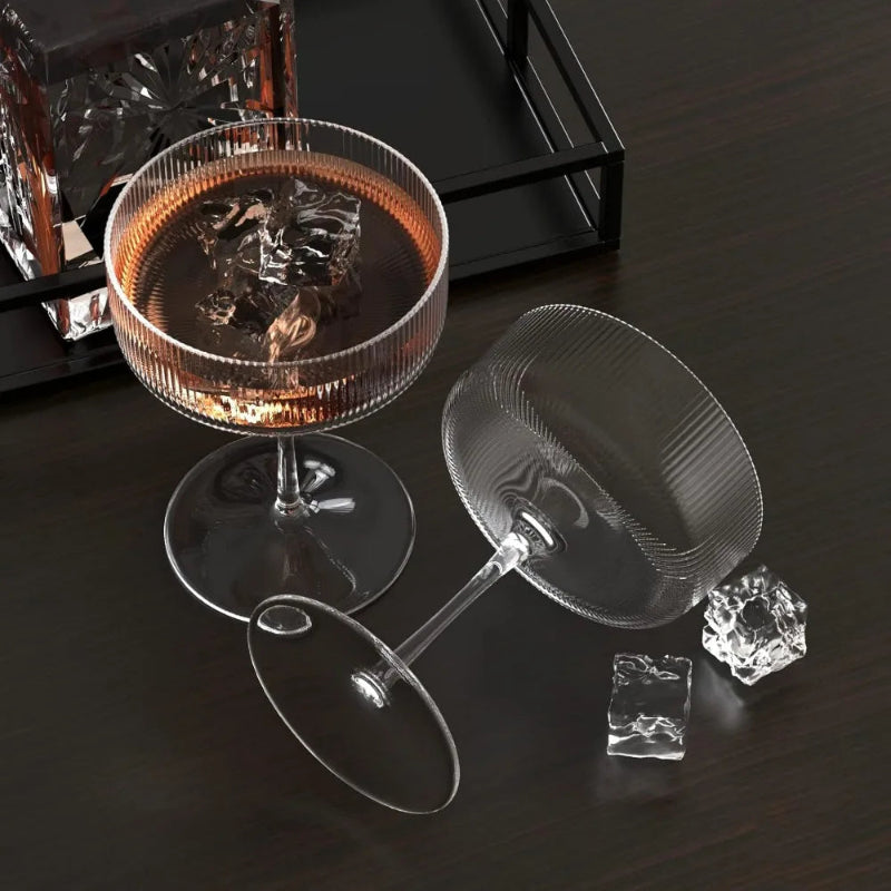 Clear glassware on a dark surface with a focus on design and material.