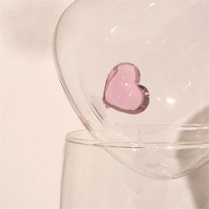 Close-up of a pink heart inside a glass.