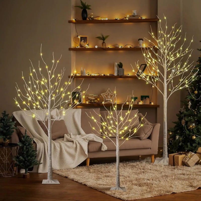 Decorative LED trees in a living room setting with a cozy ambiance.