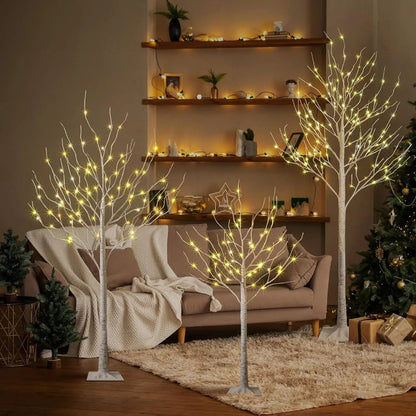 Decorative LED trees in a living room setting with a cozy ambiance.