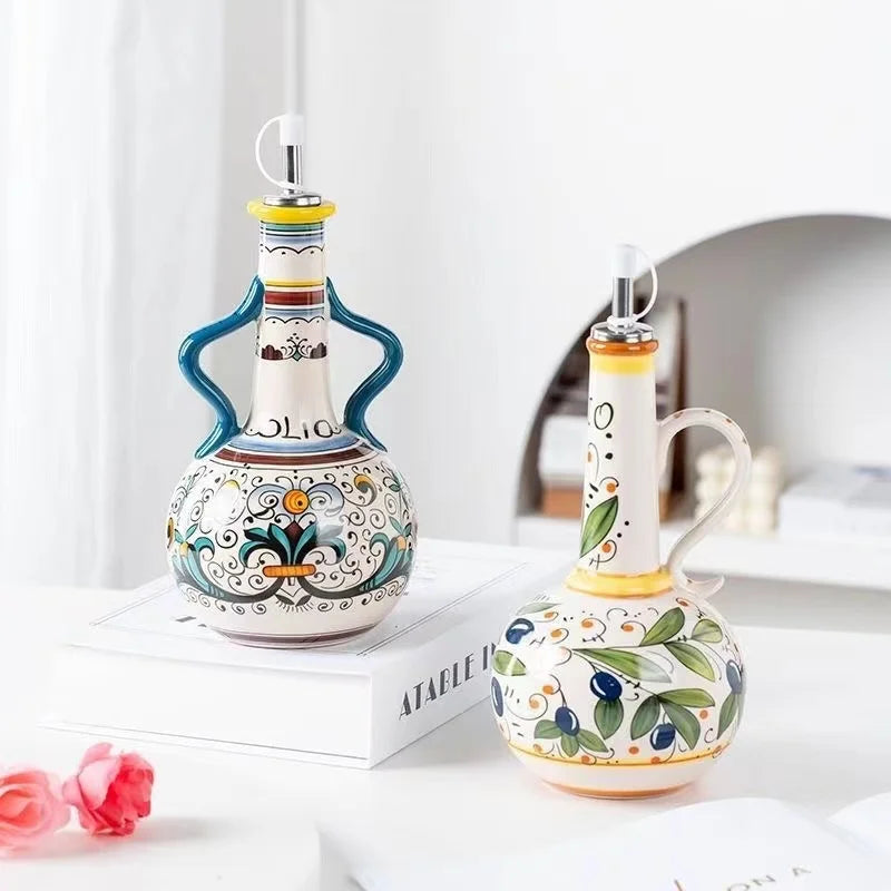 Two decorative ceramic bottles with colorful designs on a white surface.