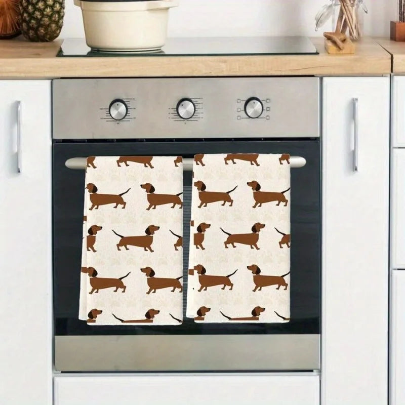 Oven with dachshund patterned towels hanging on the handle