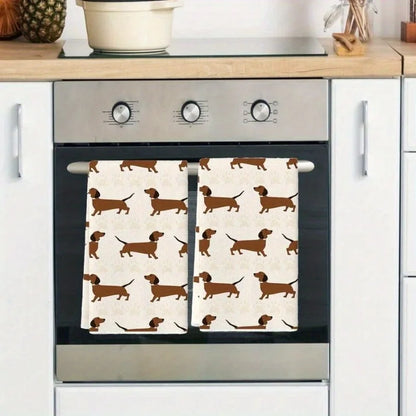 Oven with dachshund patterned towels hanging on the handle