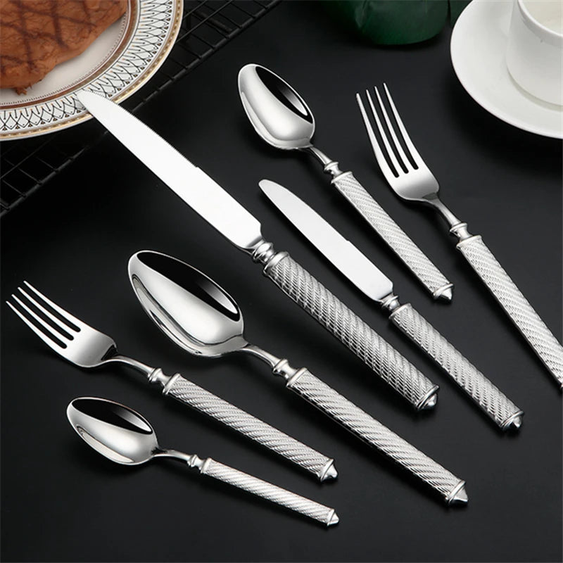 Silverware set on black surface