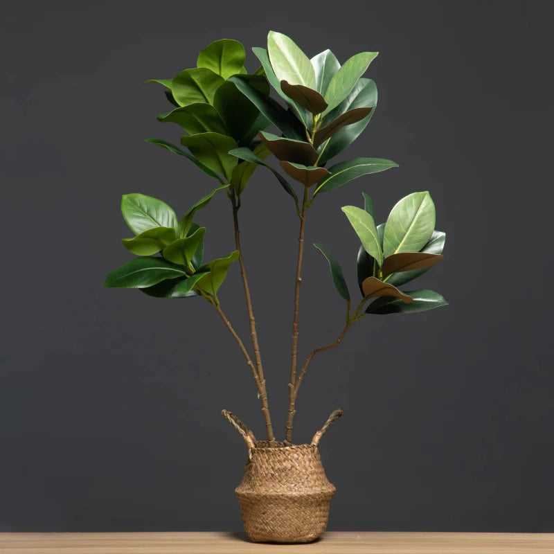 The artificial magnolia tree displayed in a seagrass basket, offering a polished and natural look. Perfect for any room, this setup enhances the tree’s lifelike beauty and adds a stylish touch.