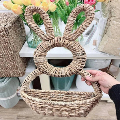 Woven bunny wall basket shown being held by hand