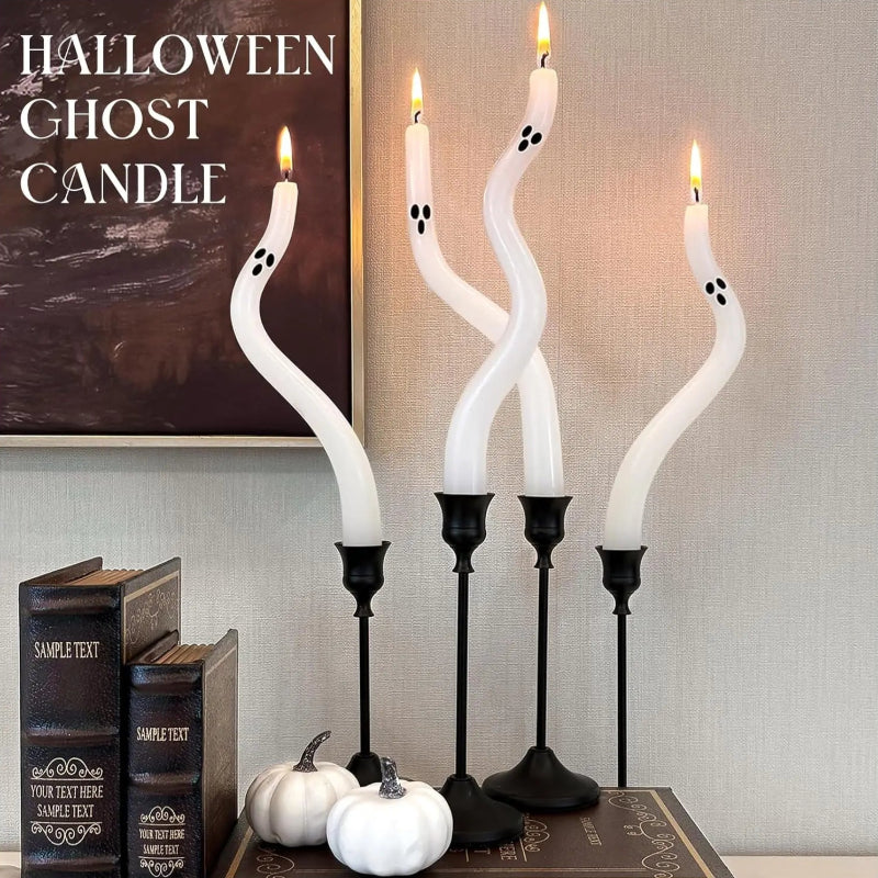 Halloween-themed ghost candle set with books and pumpkins on a table.