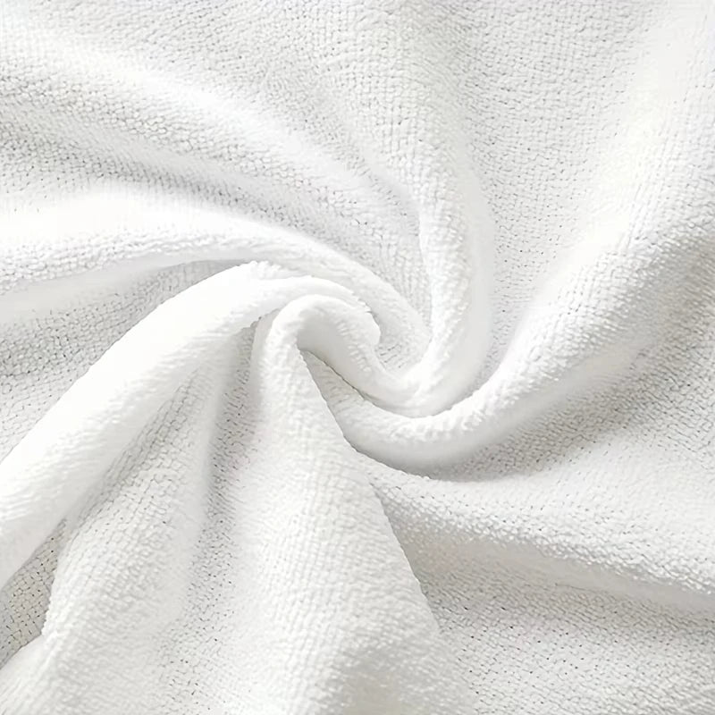 Close-up of white textured fabric with a swirl pattern