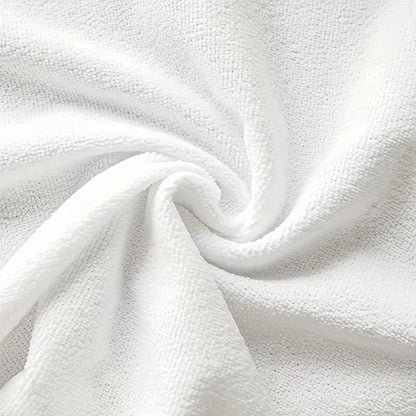 Close-up of white textured fabric with a swirl pattern