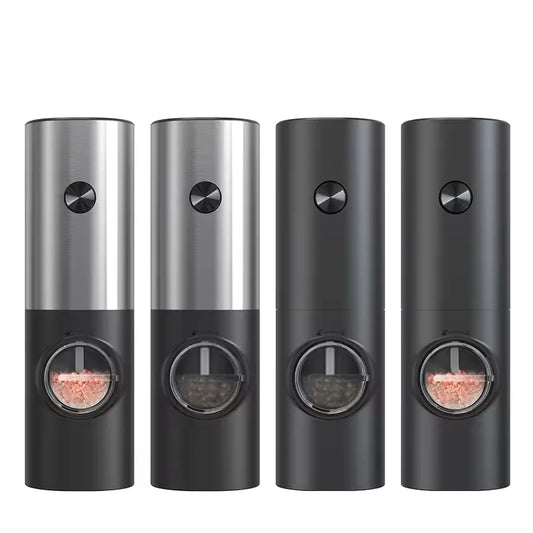Four automatic spice grinders in a row: two with silver tops filled with pink salt, and two with black tops filled with black peppercorns.