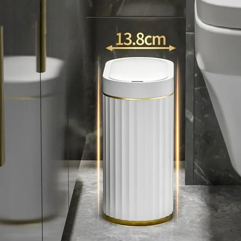 Slim, 13.8cm wide, oval smart trash can with fluted white sides and gold trim.