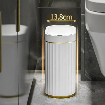 Slim, 13.8cm wide, oval smart trash can with fluted white sides and gold trim.