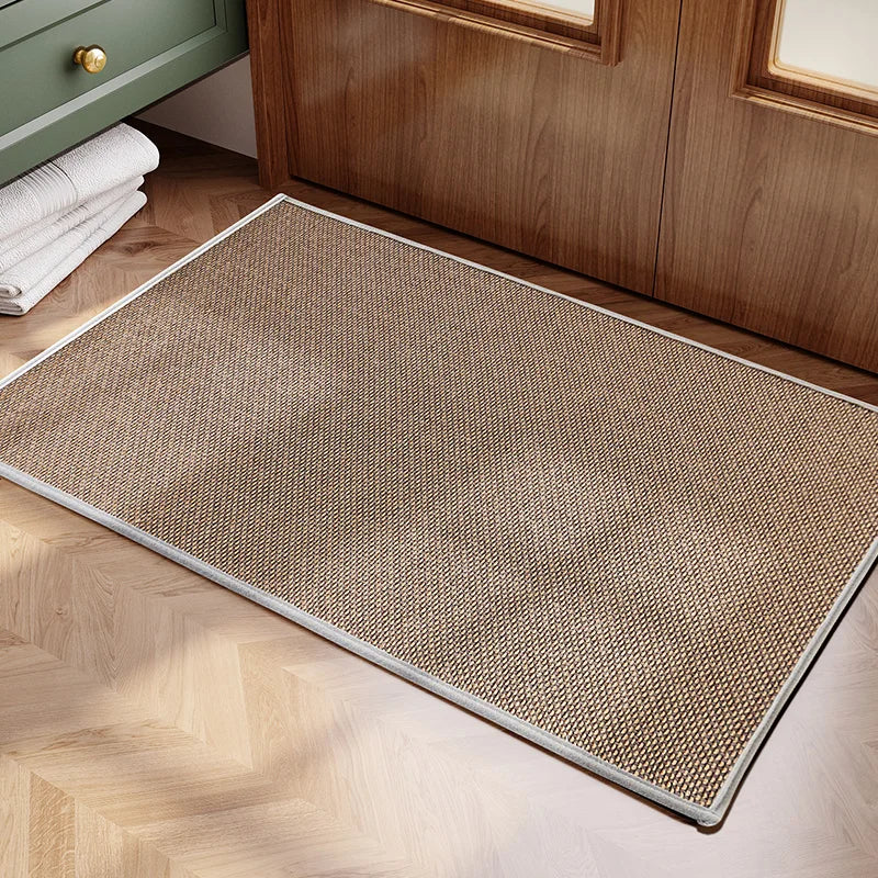 Textured doormat on a wooden floor with a wooden cabinet in the background