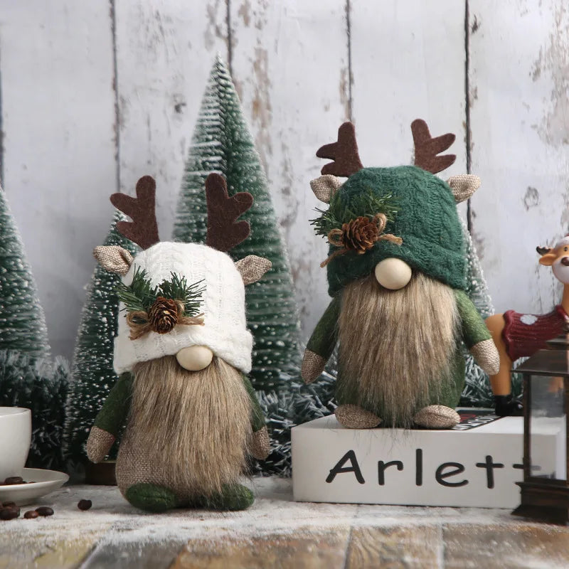 Two festive gnomes with reindeer antlers and green hats in a decorative setting.