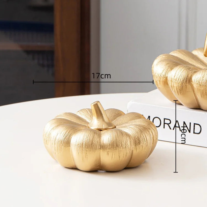 A small, textured gold pumpkin with a gold stem is shown with dimensions: 17cm wide and 10cm tall.