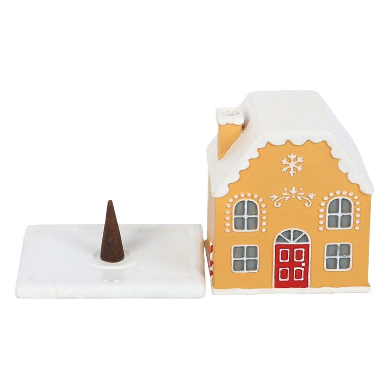 Decorative house-shaped incense burner with a cone on a white background