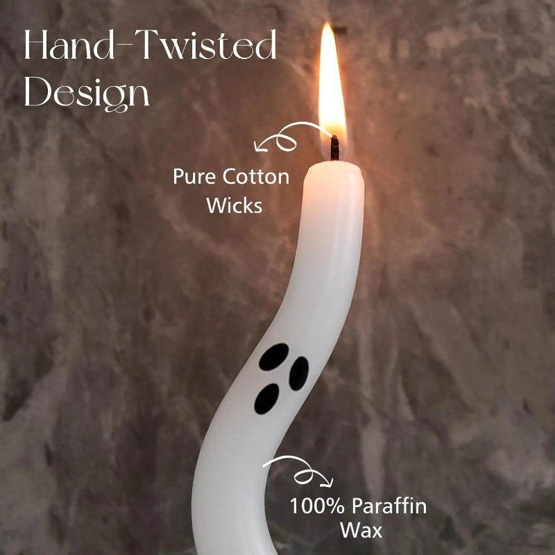 White ghost-shaped candle with flame on a textured gray background, featuring text about design, wicks, and wax.