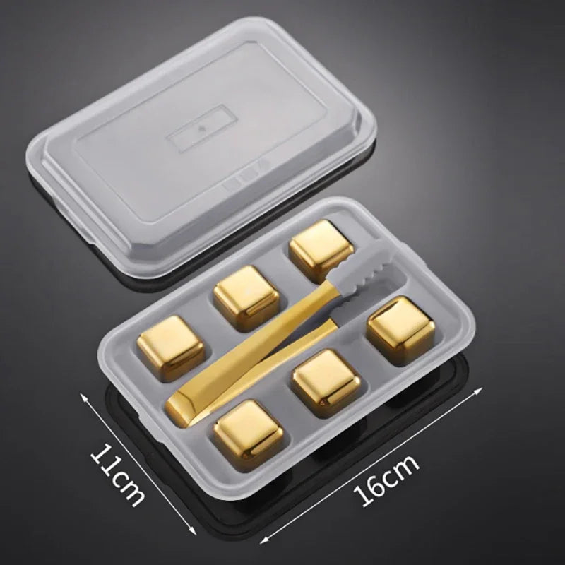 Set of gold-colored cubes and a tool in a clear plastic container with dimensions indicated.