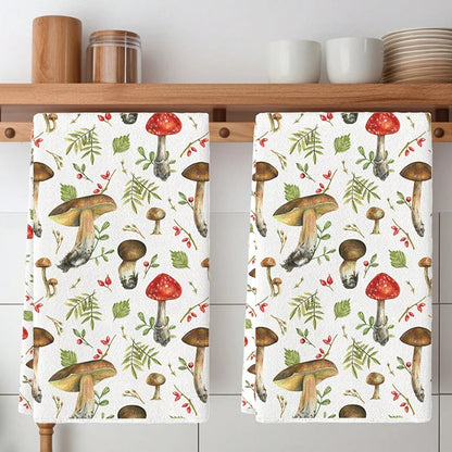 Two kitchen towels with mushroom pattern hanging on a wooden rack.