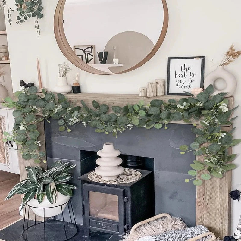 Artificial eucalyptus garland beautifully draped over a mantel, adding an effortless, calming touch to the living room decor.