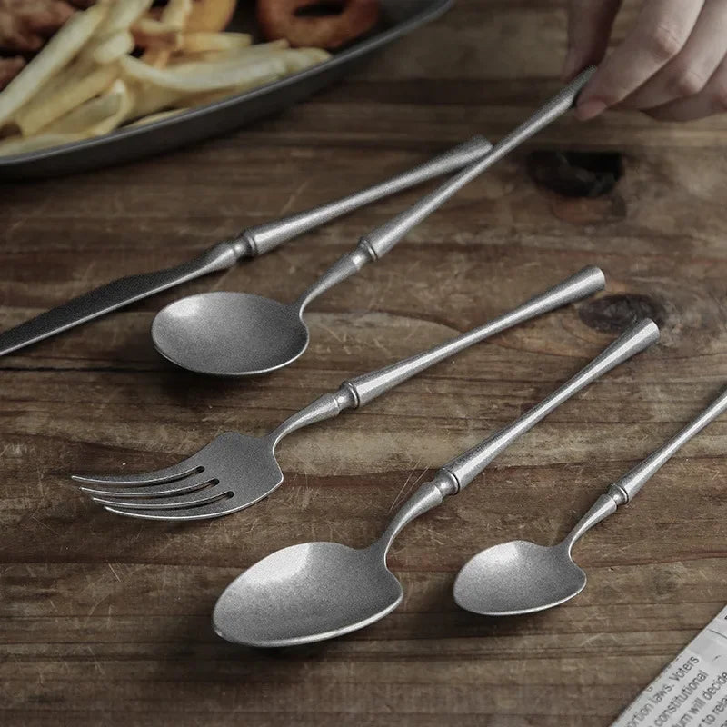 Distressed silverware on wooden table