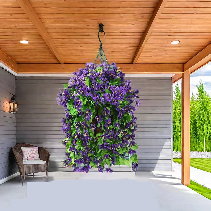 Large hanging basket of artificial purple flowers on a porch.