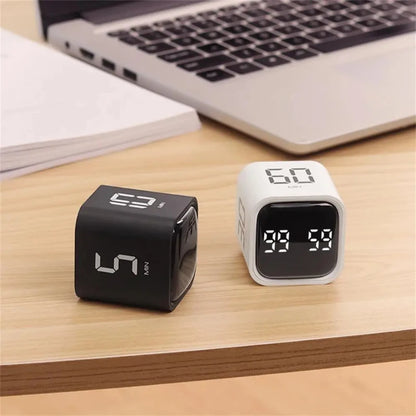 Rotating cube timer with preset intervals for work and study sessions.