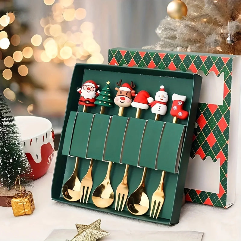 Set of gold Christmas-themed spoons in a decorative box with a festive background.