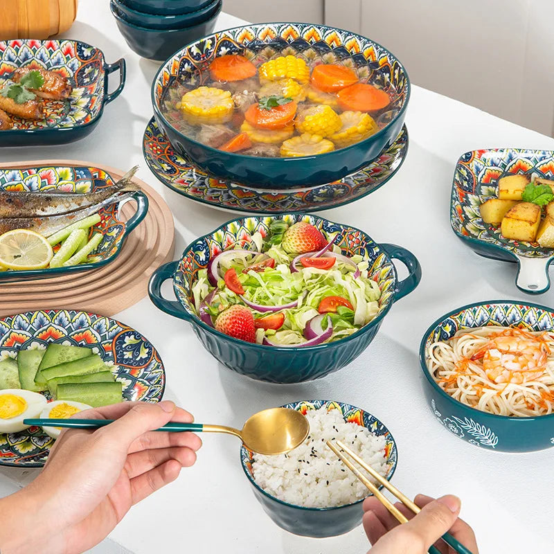 A full table set with ornate bowls and plates of food.