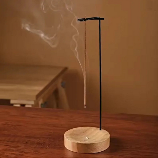 Incense burning on a modern holder.