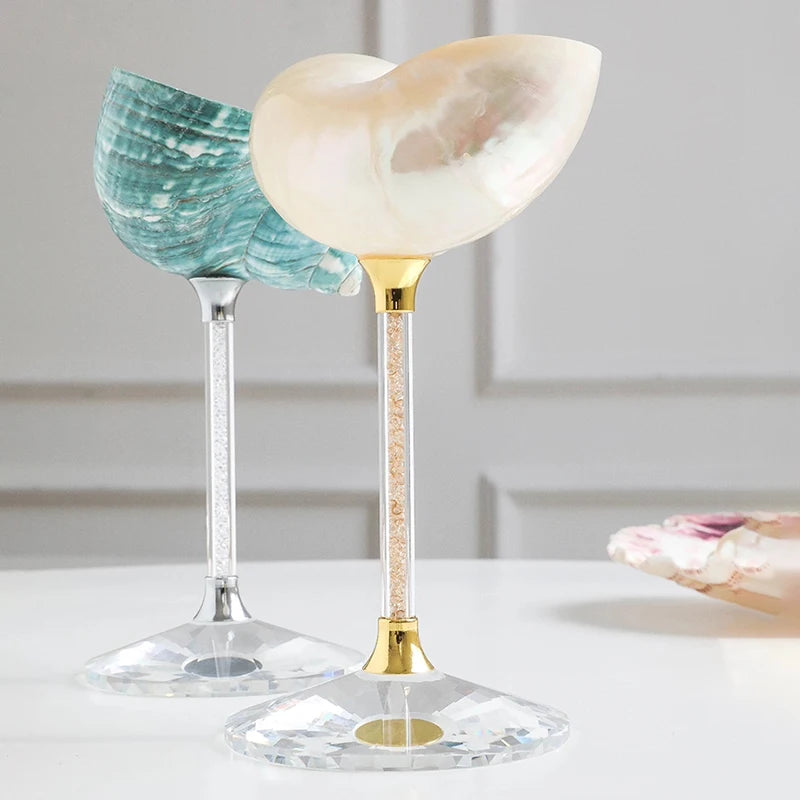 Two decorative glass items with marbled designs on a neutral background