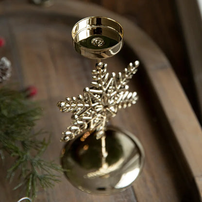 Shiny gold snowflake candle holder with a large gold ball base.