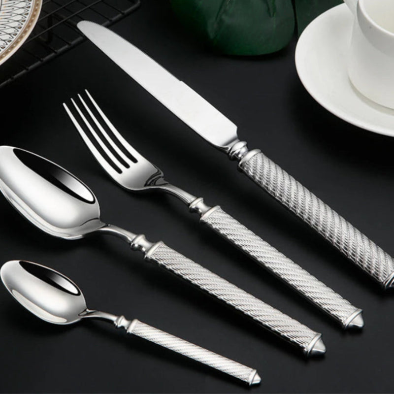 Table setting with ornate silverware