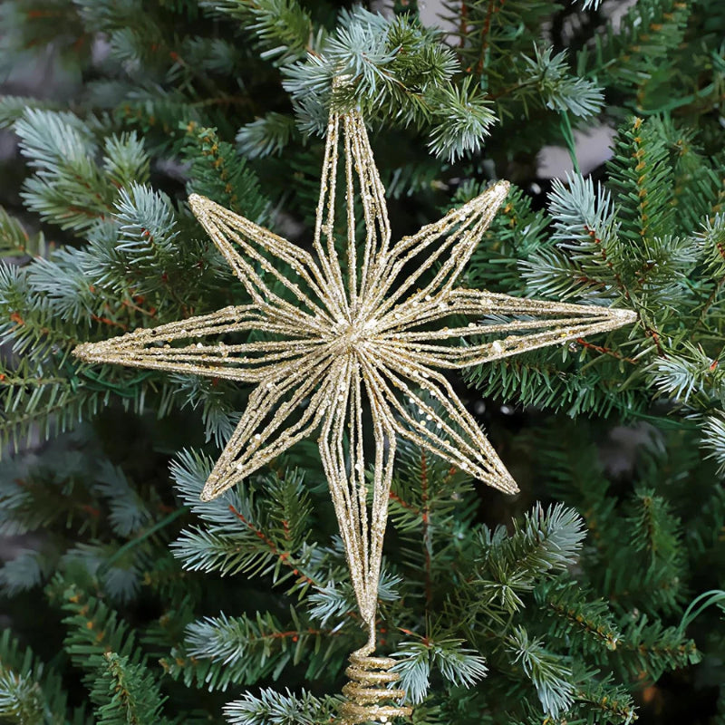 Gold glitter wire star tree topper on a Christmas tree.
