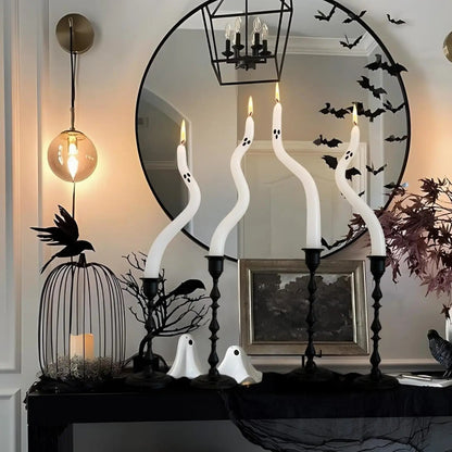 Halloween-themed decor with ghost-shaped candles, a mirror, and decorative elements.