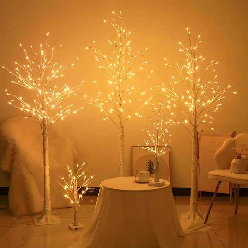 Decorative LED trees with warm lighting in a room setting.