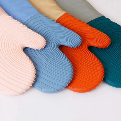 Set of colorful silicone mats in various colors on a light background