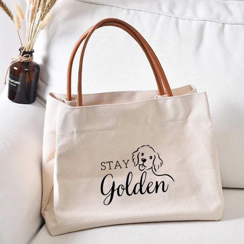Canvas tote bag with a "Stay Golden" dog graphic.