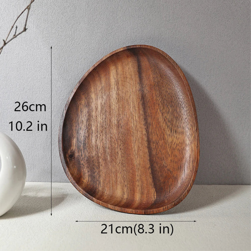 Asymmetrically shaped wooden serving tray with dimensions: 26 cm (10.2 in) long and 21 cm (8.3 in) wide.