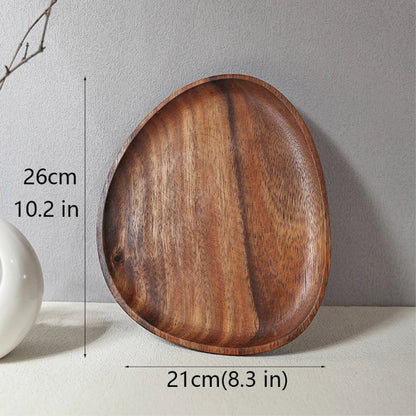 Asymmetrically shaped wooden serving tray with dimensions: 26 cm (10.2 in) long and 21 cm (8.3 in) wide.