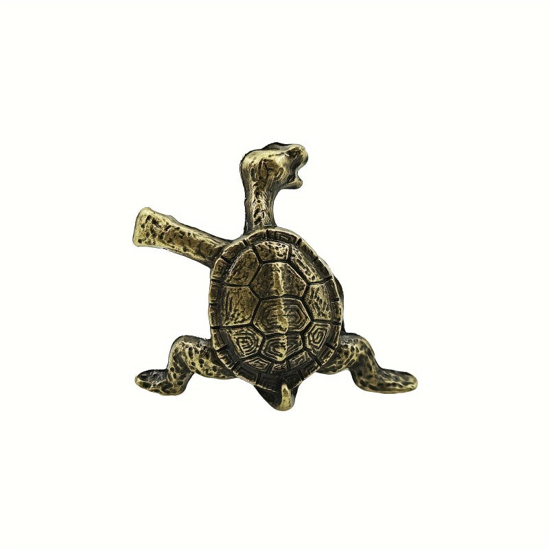 A brass turtle figurine with a detailed shell, isolated on a white background.
