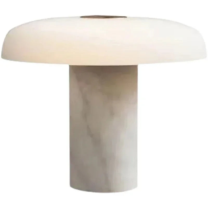 A modern mushroom-shaped table lamp with a white marble base and a white dome shade, isolated on a white background.