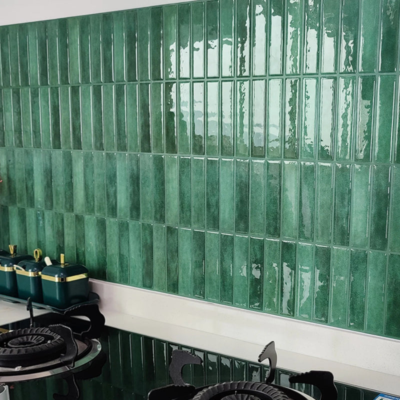 Green subway tile backsplash in a kitchen.
