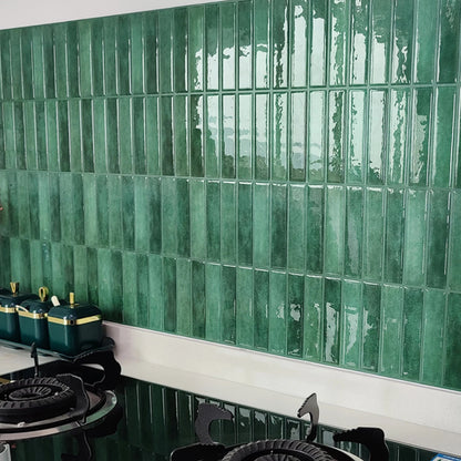 Green subway tile backsplash in a kitchen.