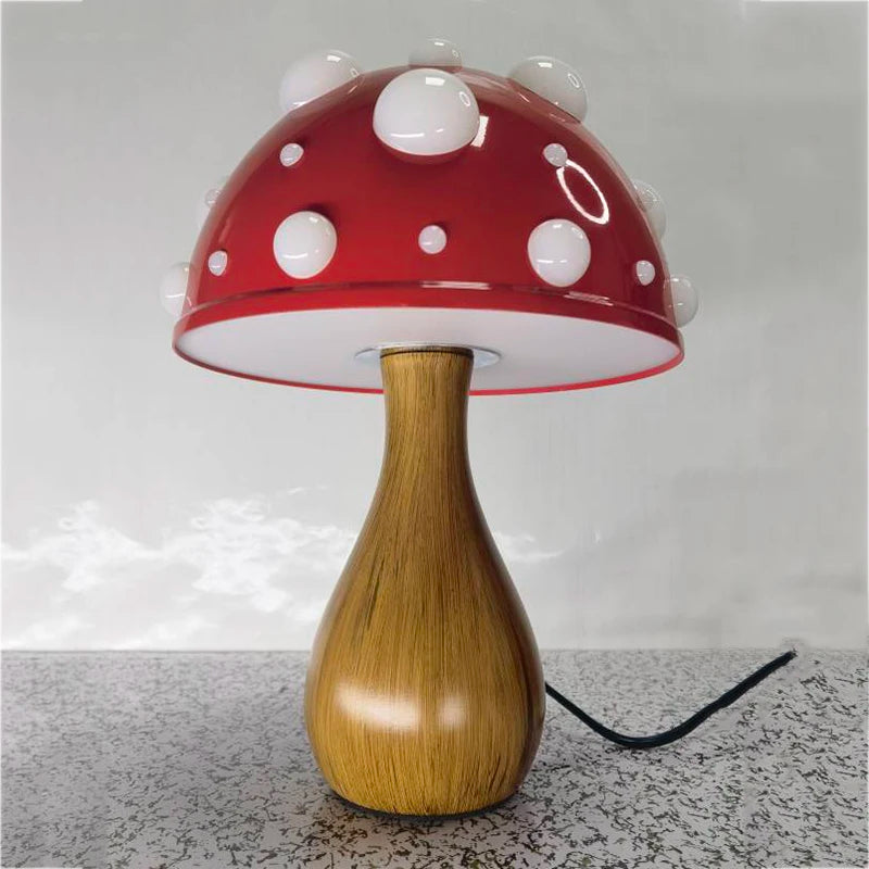 A mushroom-shaped lamp with a red cap and white spots, on a patterned surface.