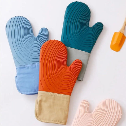 Colorful silicone oven mitts on a white background